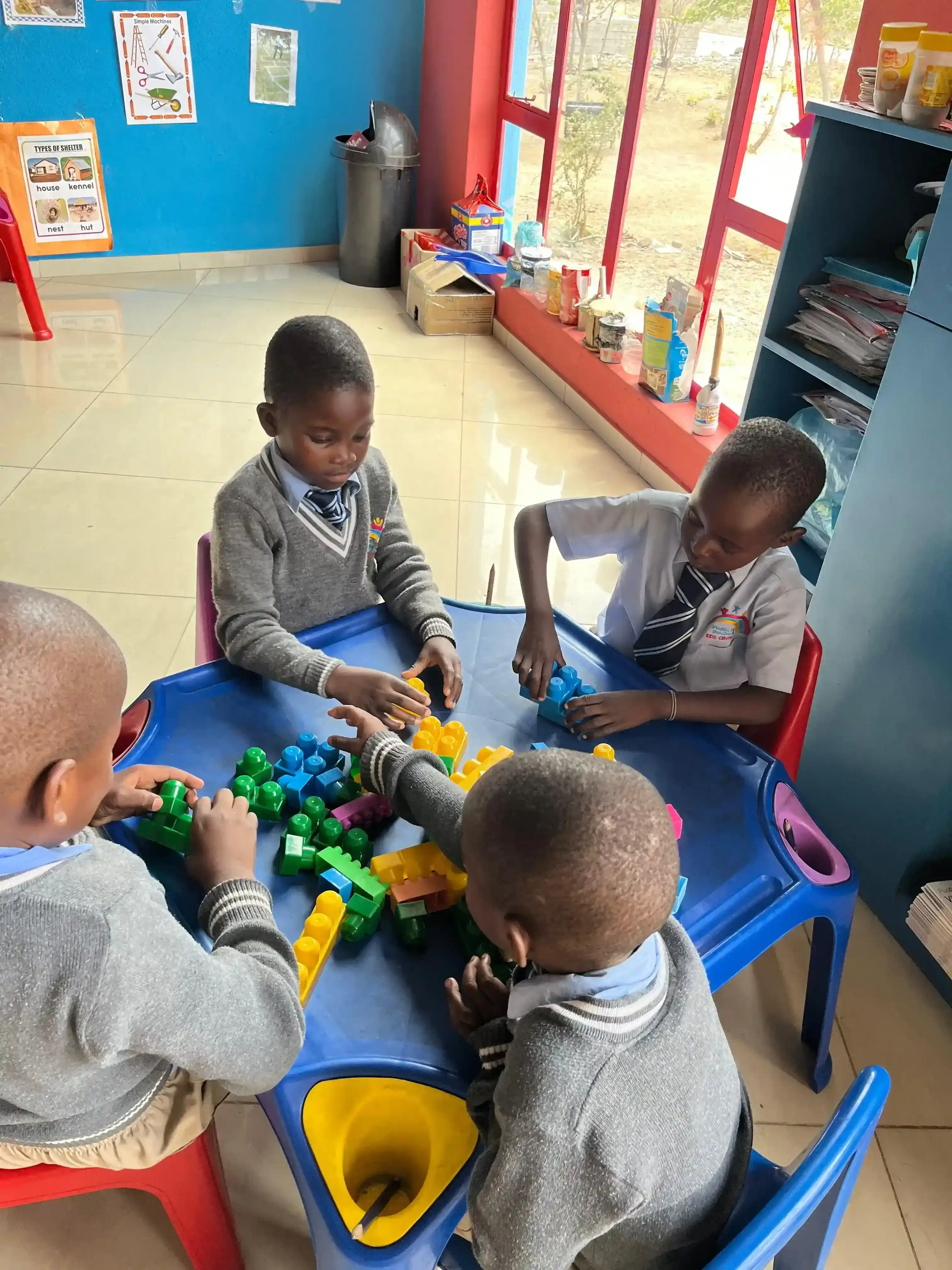 Children playing with building blocks at Sharell and Shalom Kids Centre