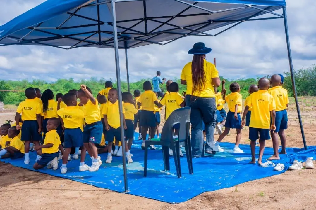 Yellow team children at sports day tent